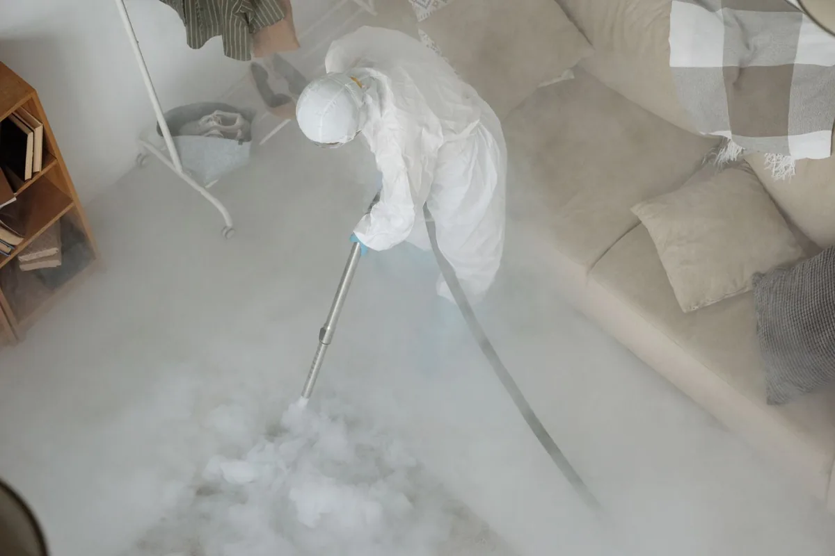 Biohazard cleanup technician in protective equipment, Avoca, NY